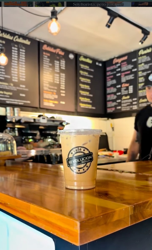Coffee corner · iced coffee Café Revolución on warm wood counter
